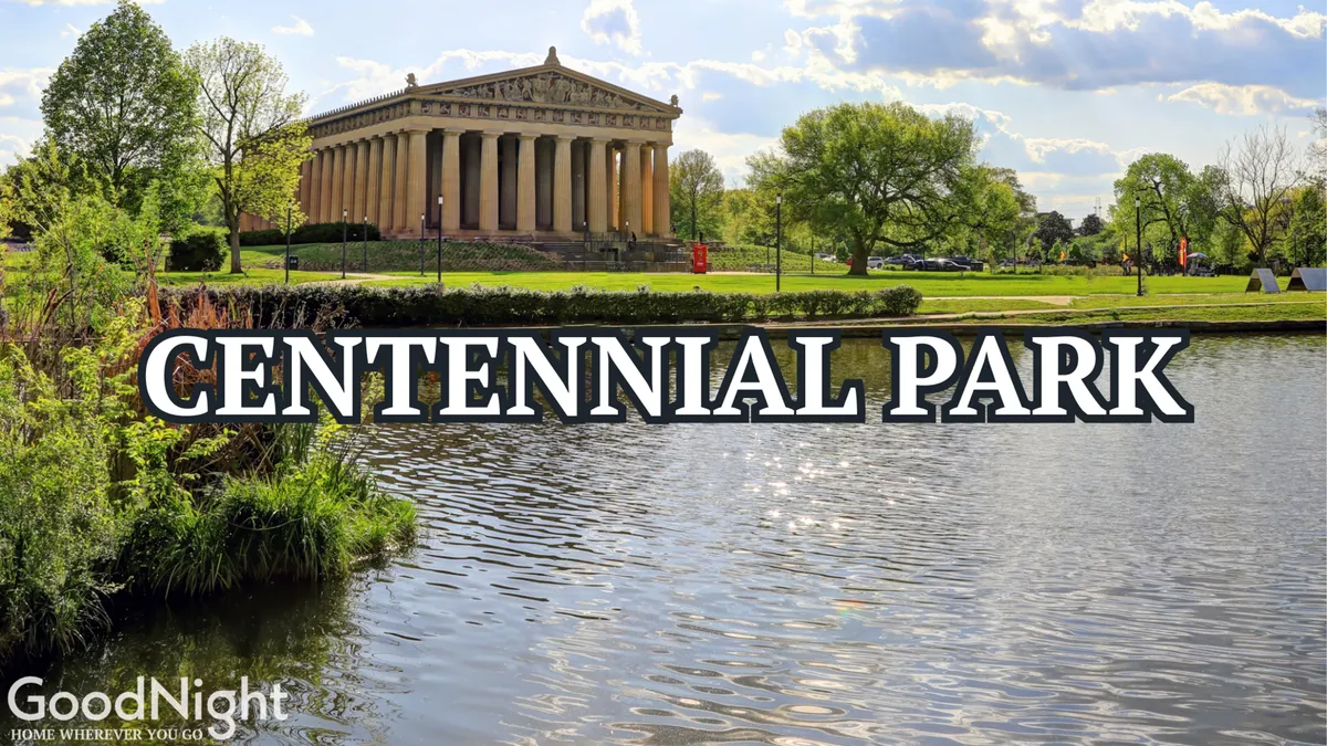 This image features the iconic Parthenon-like building in Centennial Park, reflected in nearby water and surrounded by lush greenery. People can be seen enjoying the outdoors, possibly walking, picnicking, or attending an event. The serene mood and open space invite exploration and family activities.